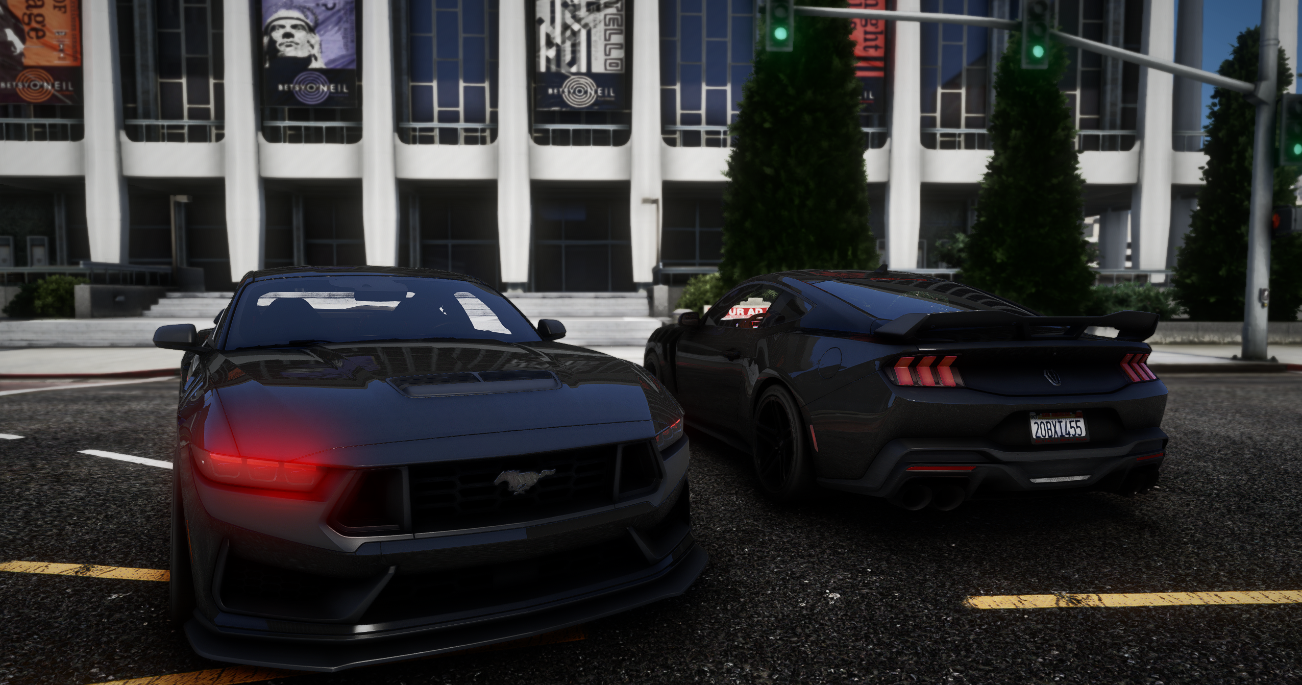 Two black performance cars parked downtown