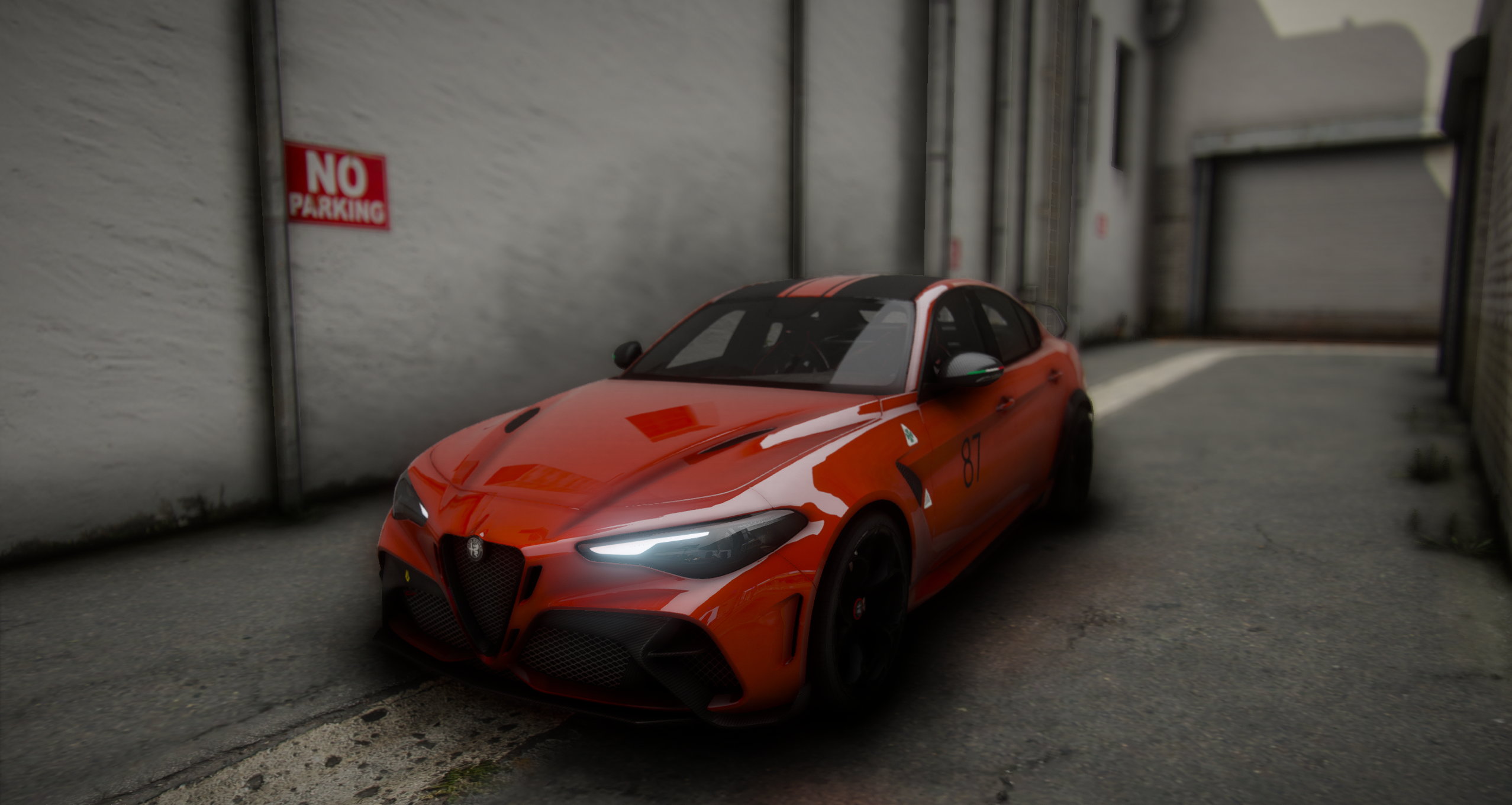 Orange coupe in a garage bay