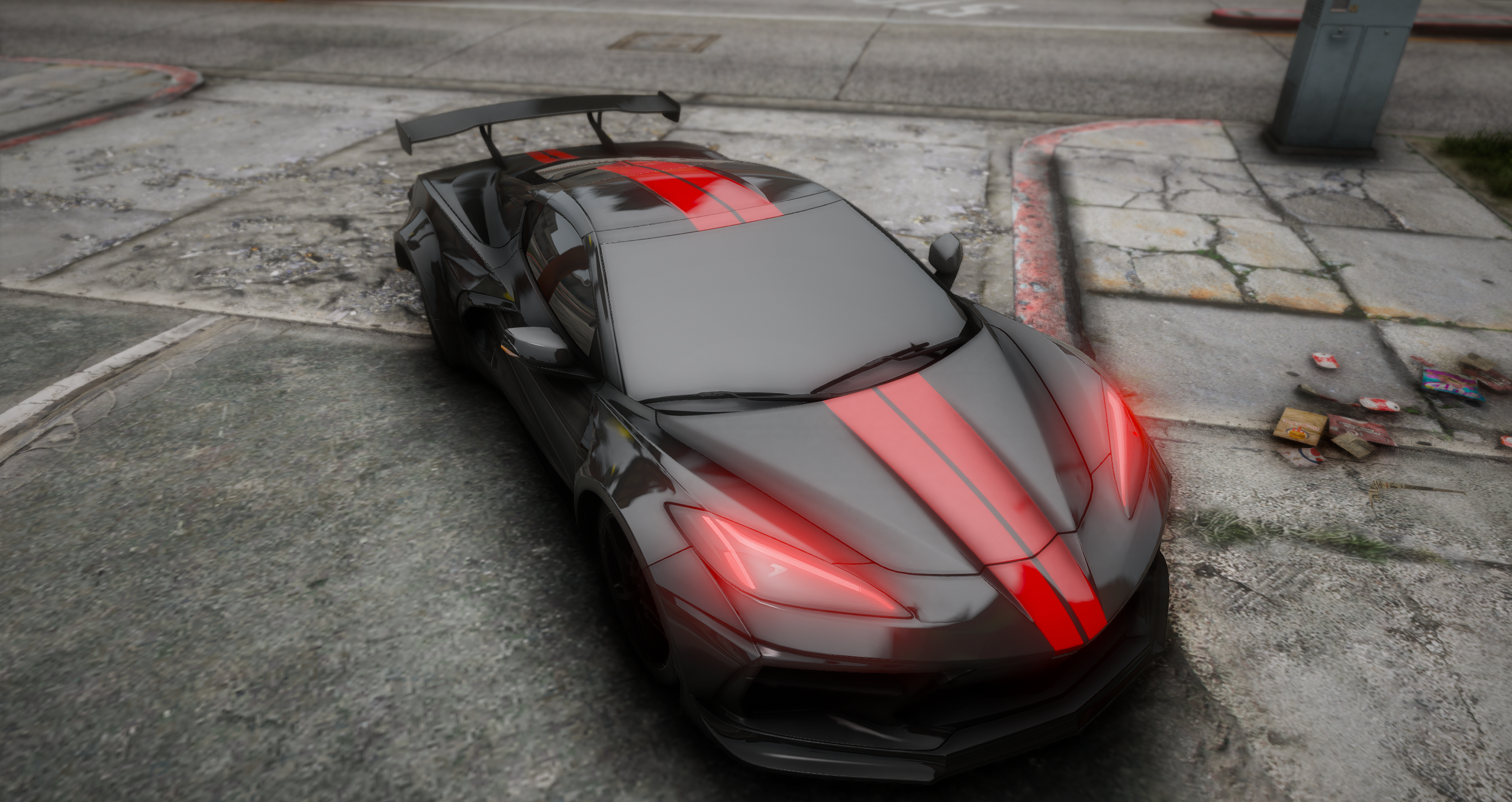 Black and red exotic car viewed from above