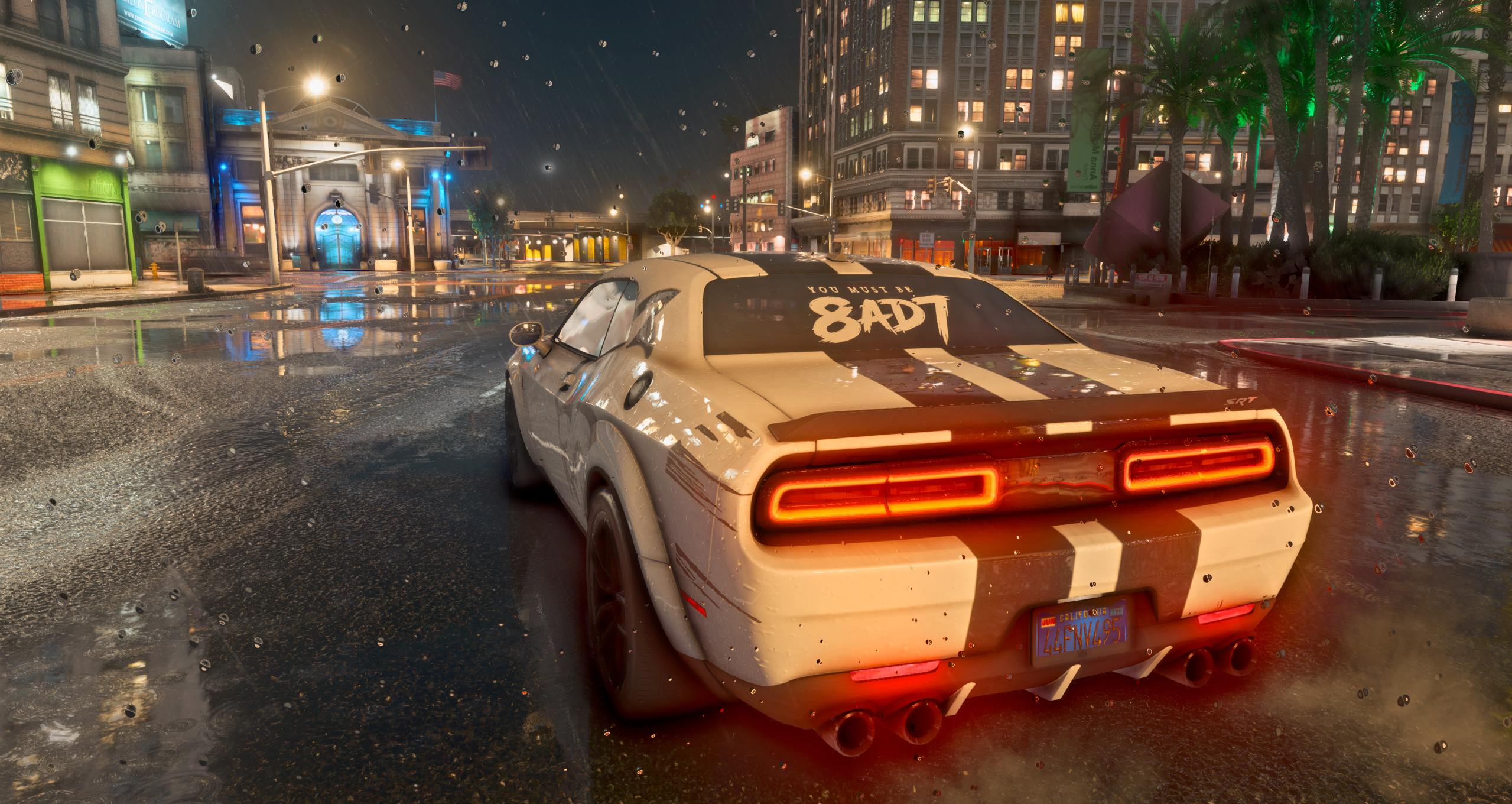 White performance car driving at night in the city